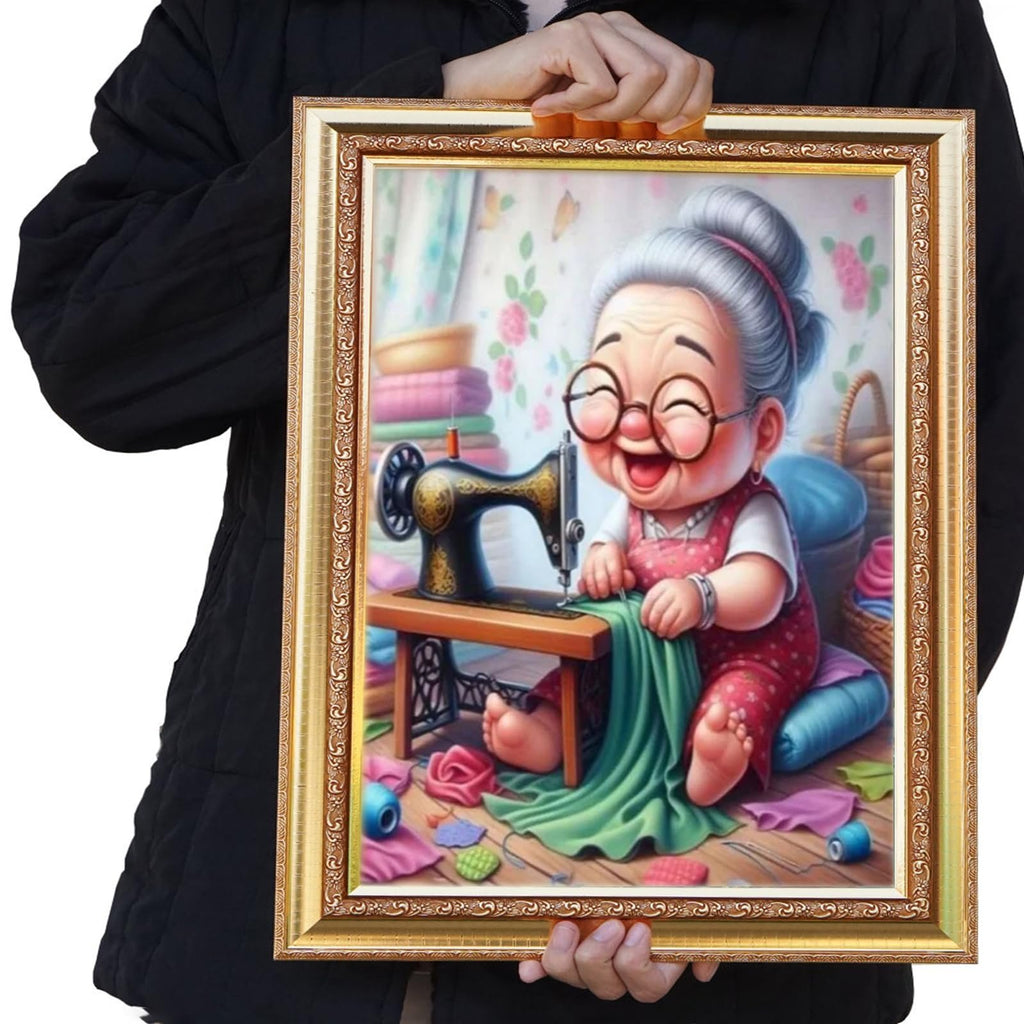 Cartoon grandma with glasses sewing at a vintage machine, surrounded by fabric scraps and thread, in a framed 5D diamond art kit.