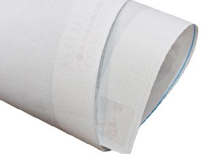 Rolled white canvas for diamond painting kit, showing textured surface and blue stitching on edge.