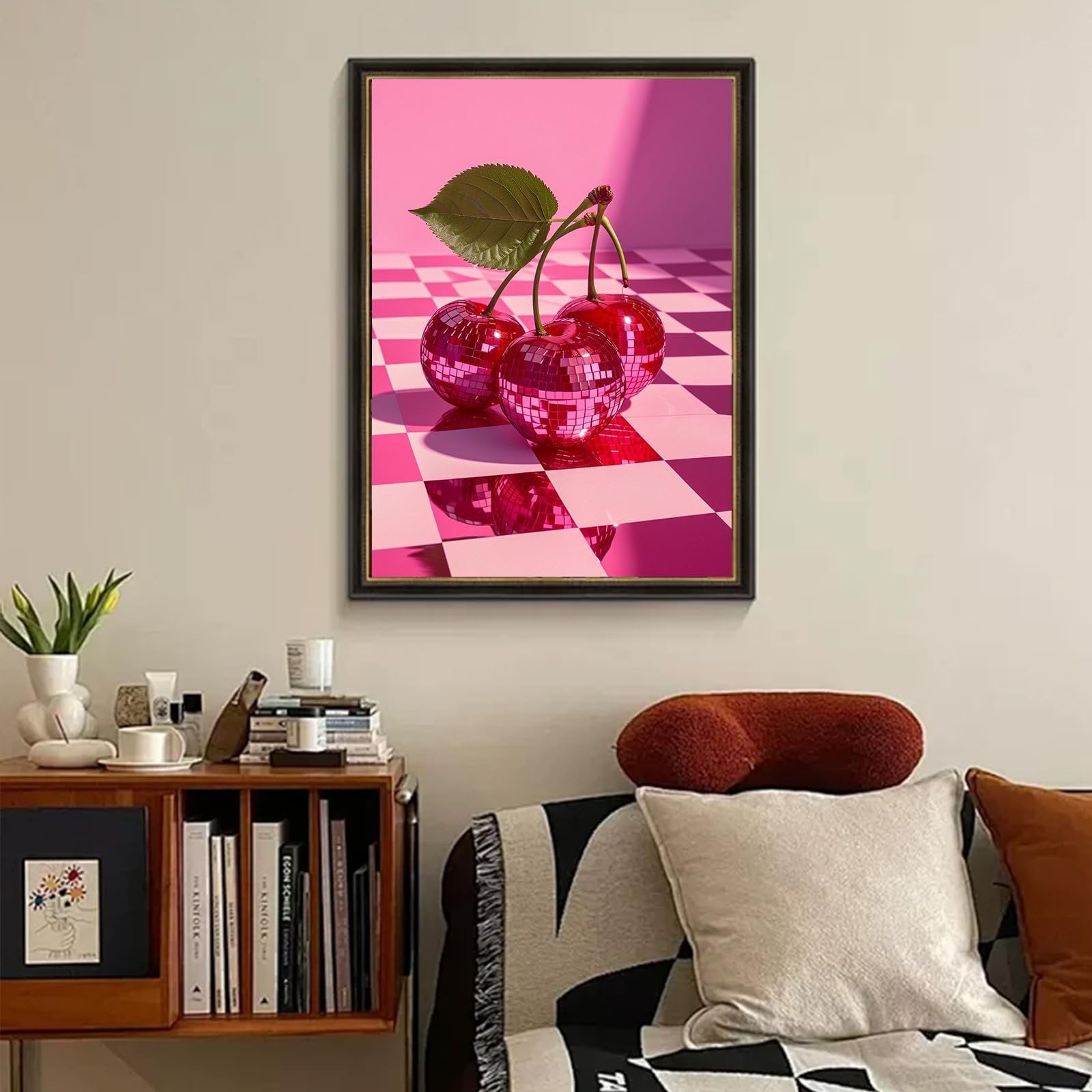 Framed diamond painting art of three disco ball cherries with a leaf on a pink checkered floor.
