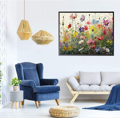 Framed colorful flower diamond painting art displayed on a wall above a blue armchair and sofa.