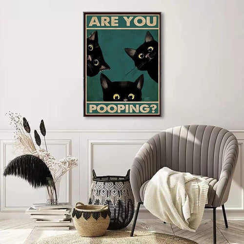 Poster with three black cats peeking over a ledge with text ARE YOU POOPING?