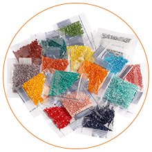 Diamond art kit contents: multiple small plastic bags filled with colorful resin diamonds for crafting.