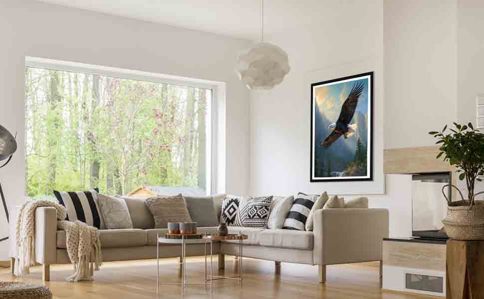 Framed diamond art painting of a soaring eagle displayed on a living room wall above a sectional sofa.