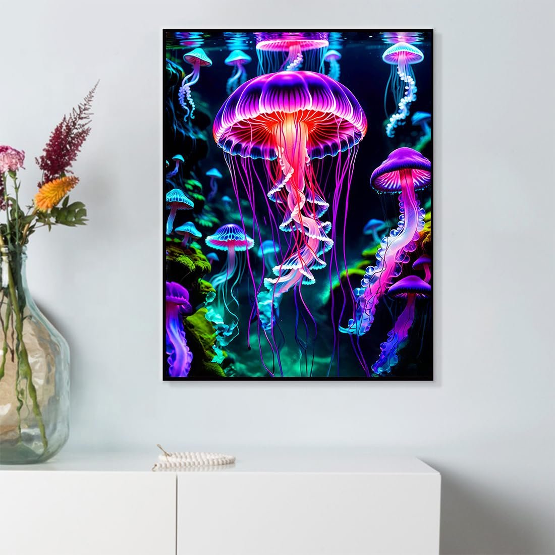 Glowing jellyfish diamond painting kit displayed on a white dresser, vibrant colors, underwater scene.