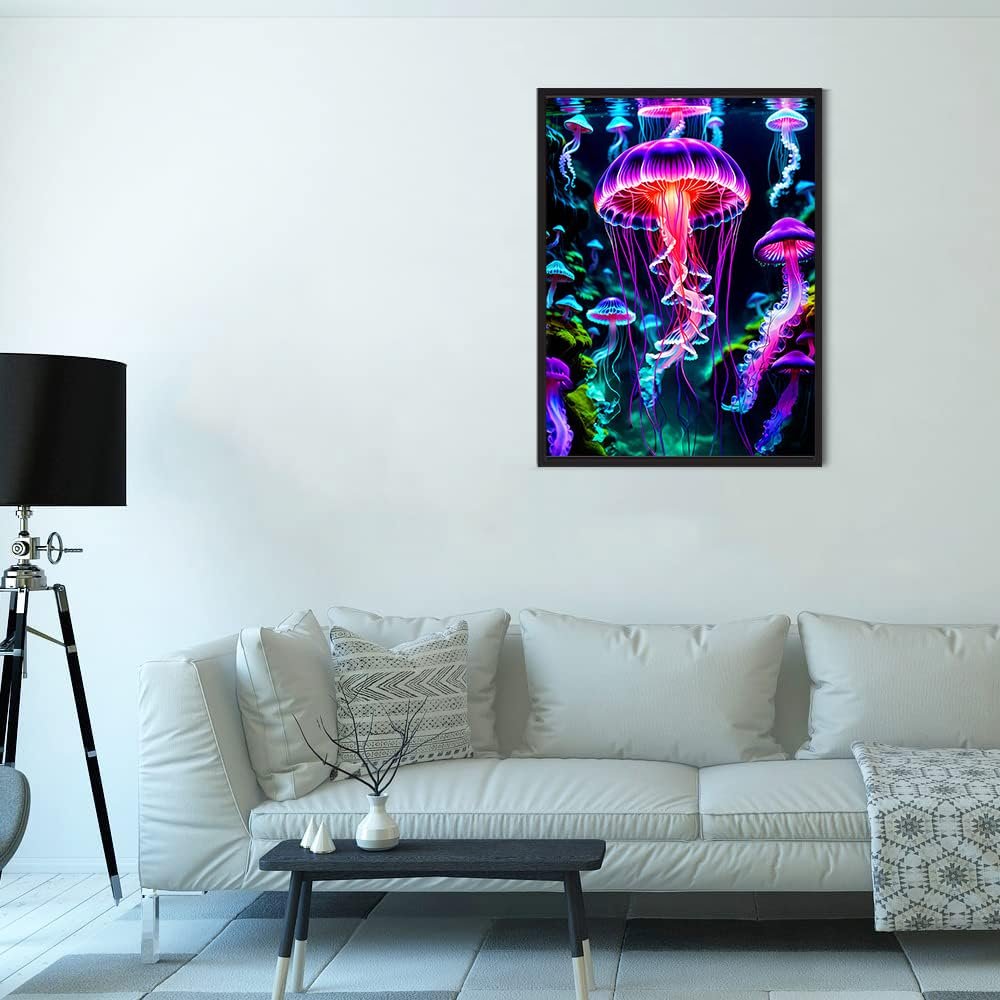 Framed 5D diamond painting of glowing jellyfish in neon colors hanging on a wall above a sofa.