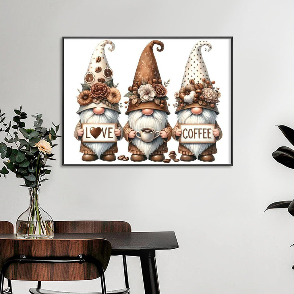 Three gnomes holding signs and a coffee cup, part of a diamond art kit.