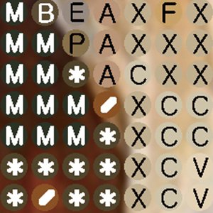 Close-up of diamond painting beads with letters and symbols for crafting