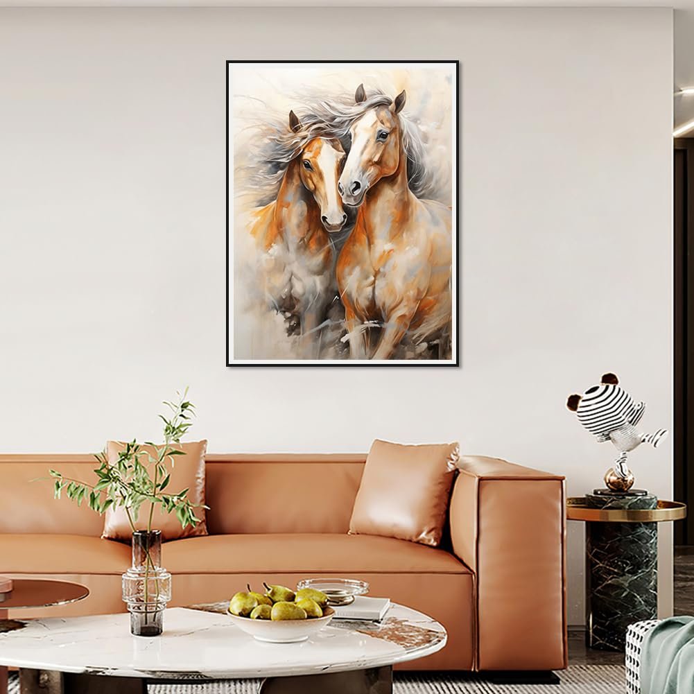 Two horses running together in a watercolor-style painting, framed and hung above a sofa.
