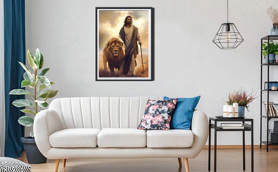 Jesus and a lion walking together in a desert landscape, framed artwork on a wall above a sofa.