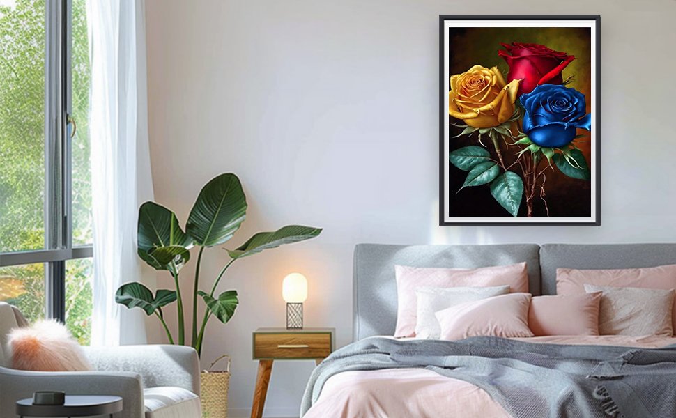 Framed diamond painting of three roses (yellow, red, blue) hanging on a bedroom wall above a bed.