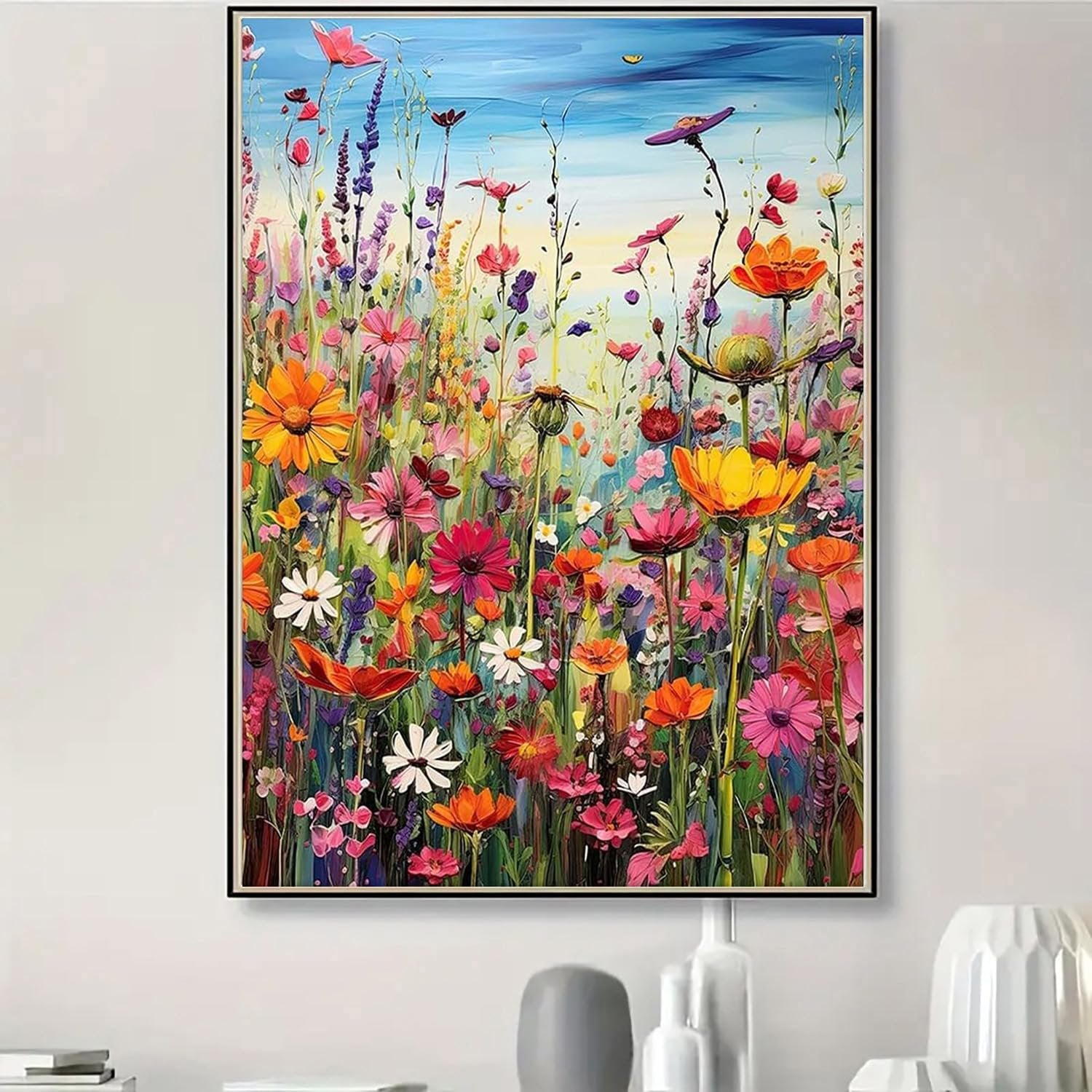 Vibrant oil painting of a field of wildflowers under a blue sky, featuring orange, pink, and white flowers.