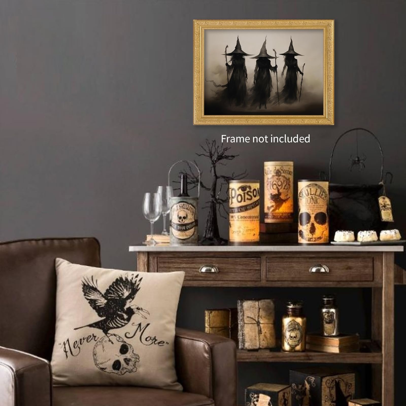 Gothic Halloween decor scene with a framed print of three witches, decorative jars, and a pillow with a crow and skull.