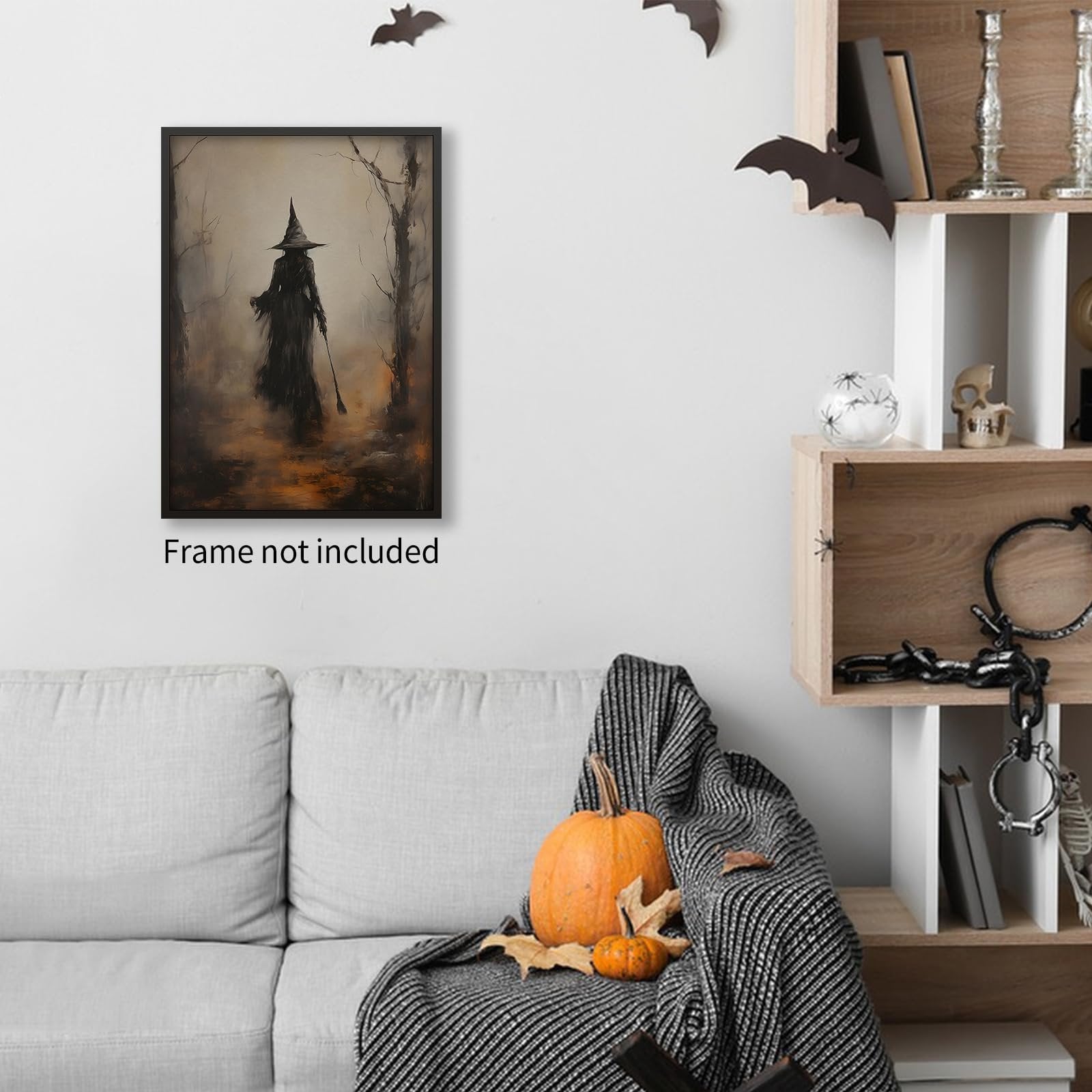 Dark moody witch in forest canvas wall art displayed above a sofa with Halloween decorations