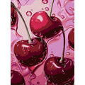 Close-up of a diamond painting canvas featuring dripping cherries with water droplets on a pink background.