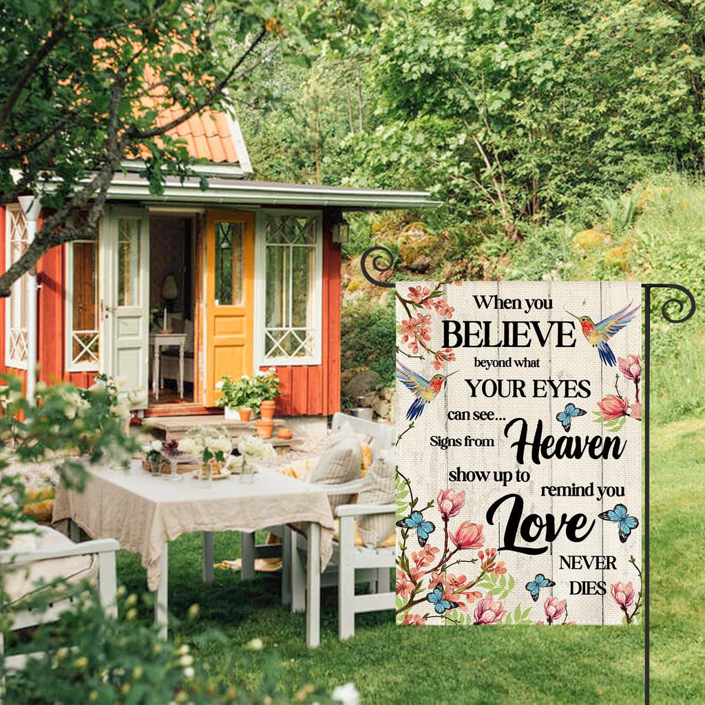 Double-sided garden flag with hummingbirds, butterflies, and flowers, displaying a memorial quote about belief and love.