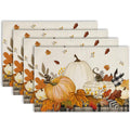 Set of four autumn placemats featuring pumpkins, maple leaves, and plaid trim on a textured background.