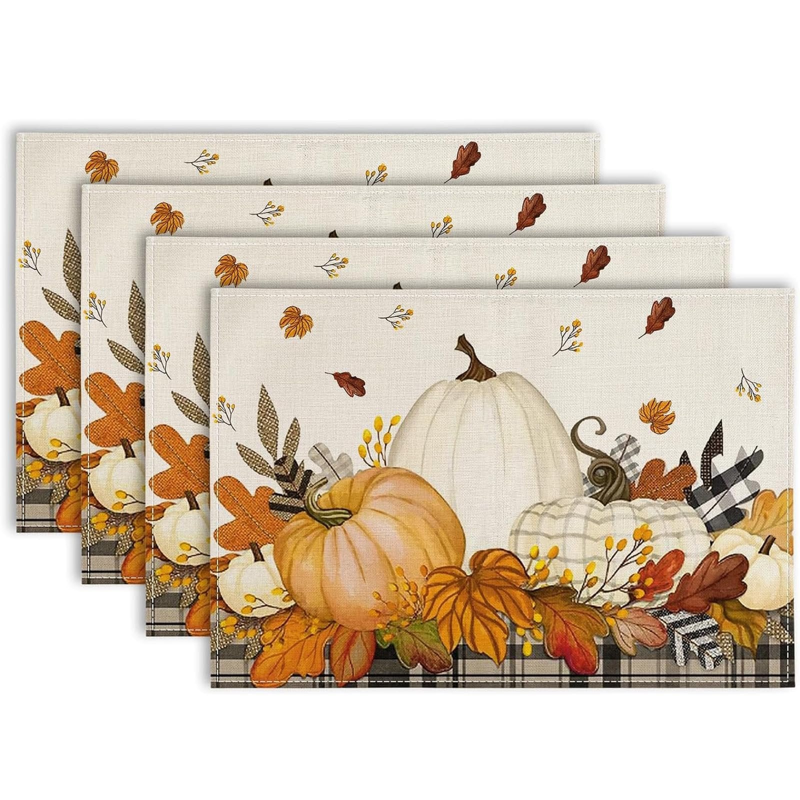 Set of four autumn placemats featuring pumpkins, maple leaves, and plaid trim on a textured background.