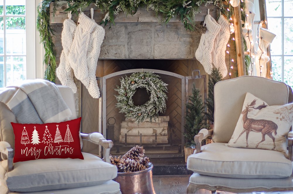 Christmas tree lumbar pillow cover with 'Merry Christmas' text on a chair in a festive living room setting.