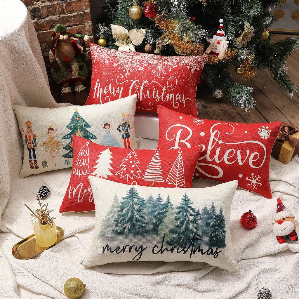 Collection of Christmas-themed lumbar pillow covers arranged around a decorated Christmas tree.