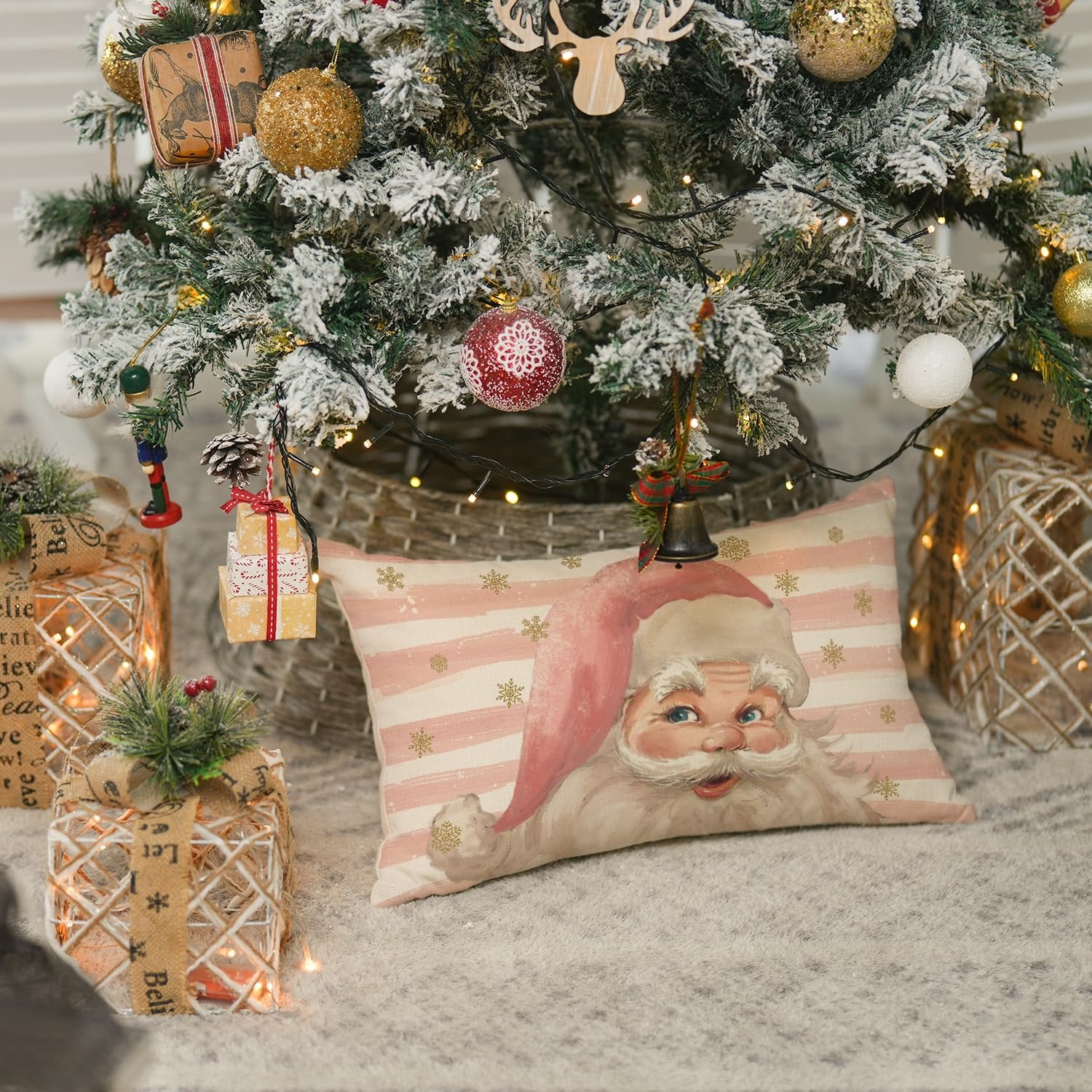 Christmas pillow cover with Santa Claus design resting under a decorated tree with gifts
