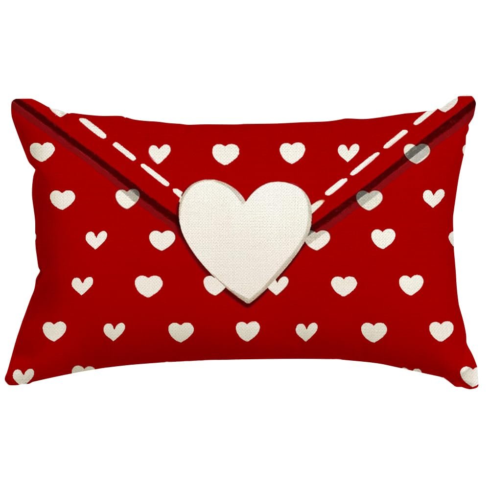 Red lumbar pillow cover with white heart pattern and a large white heart applique resembling an envelope flap.