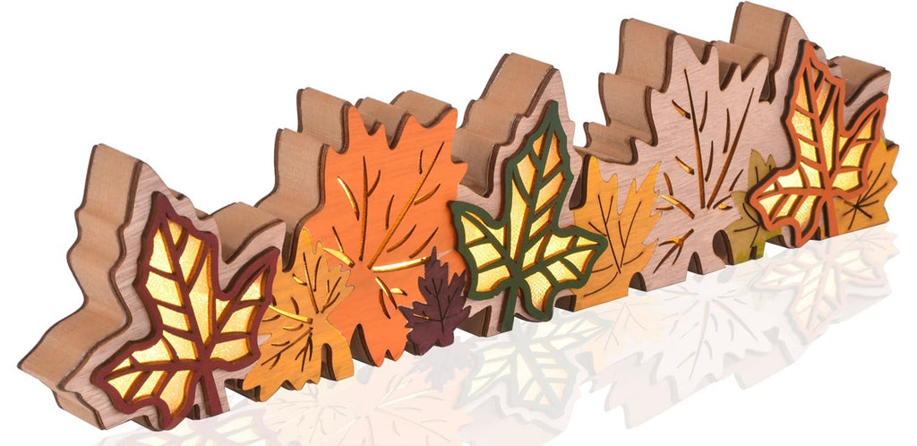 Wooden maple leaf block sign with LED lights, arranged in a row, showcasing fall colors and intricate cutouts.