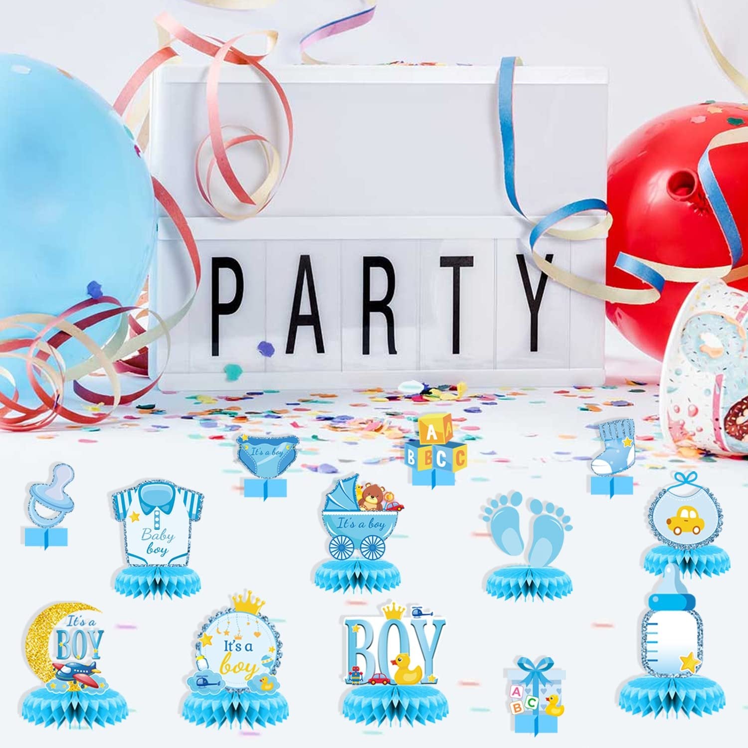 Baby shower honeycomb centerpieces with various boy-themed designs like baby bottles, footprints, and onesies.