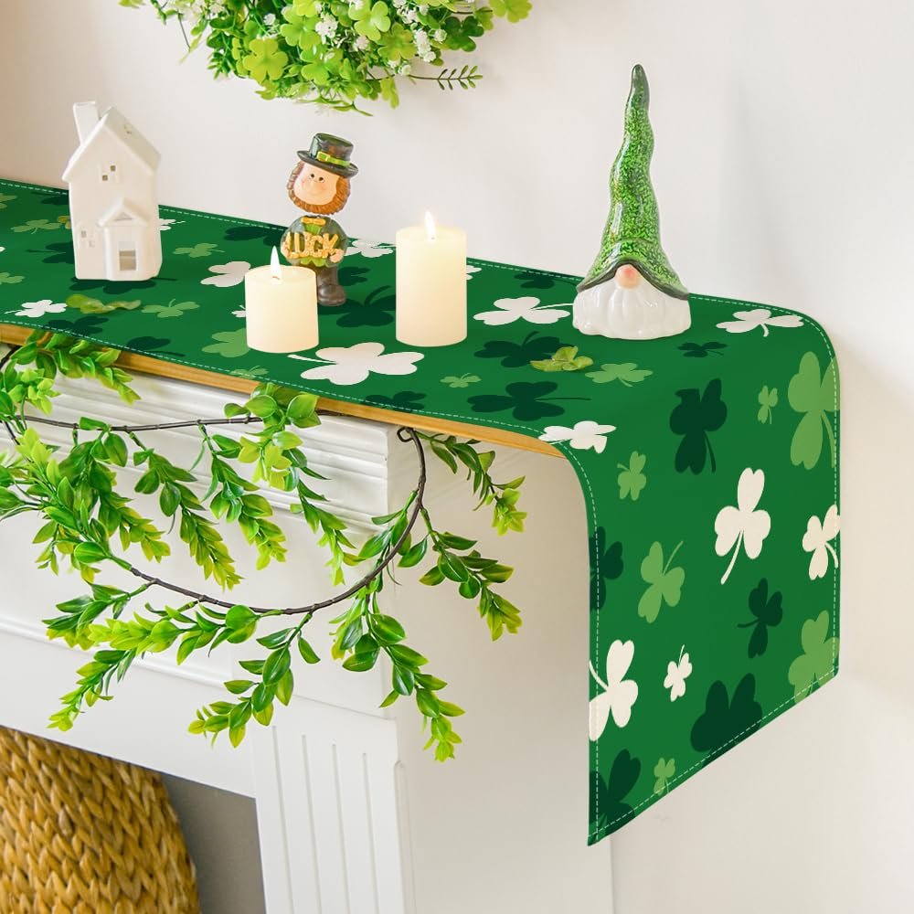 Green St. Patrick's Day table runner with shamrock pattern draped over a mantelpiece with decorations