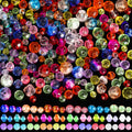 Assortment of colorful faceted glass beads for jewelry making, displayed on a black background.
