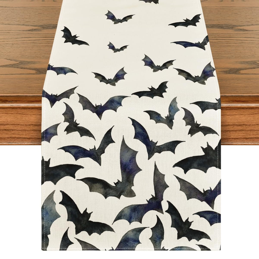 Black bats Halloween table runner on a wooden table, top-down view