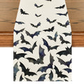 Black bats Halloween table runner on a wooden table, top-down view