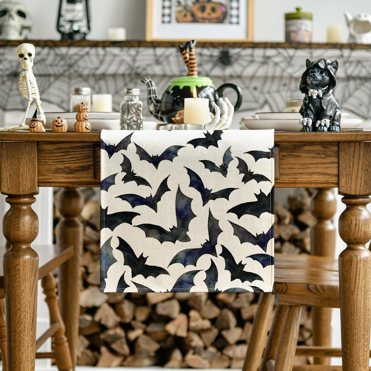 Black bats Halloween table runner on a wooden dining table with Halloween decorations