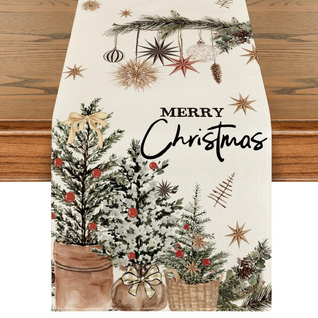 Christmas table runner with pine trees, ornaments, and 'Merry Christmas' text on a wooden table.