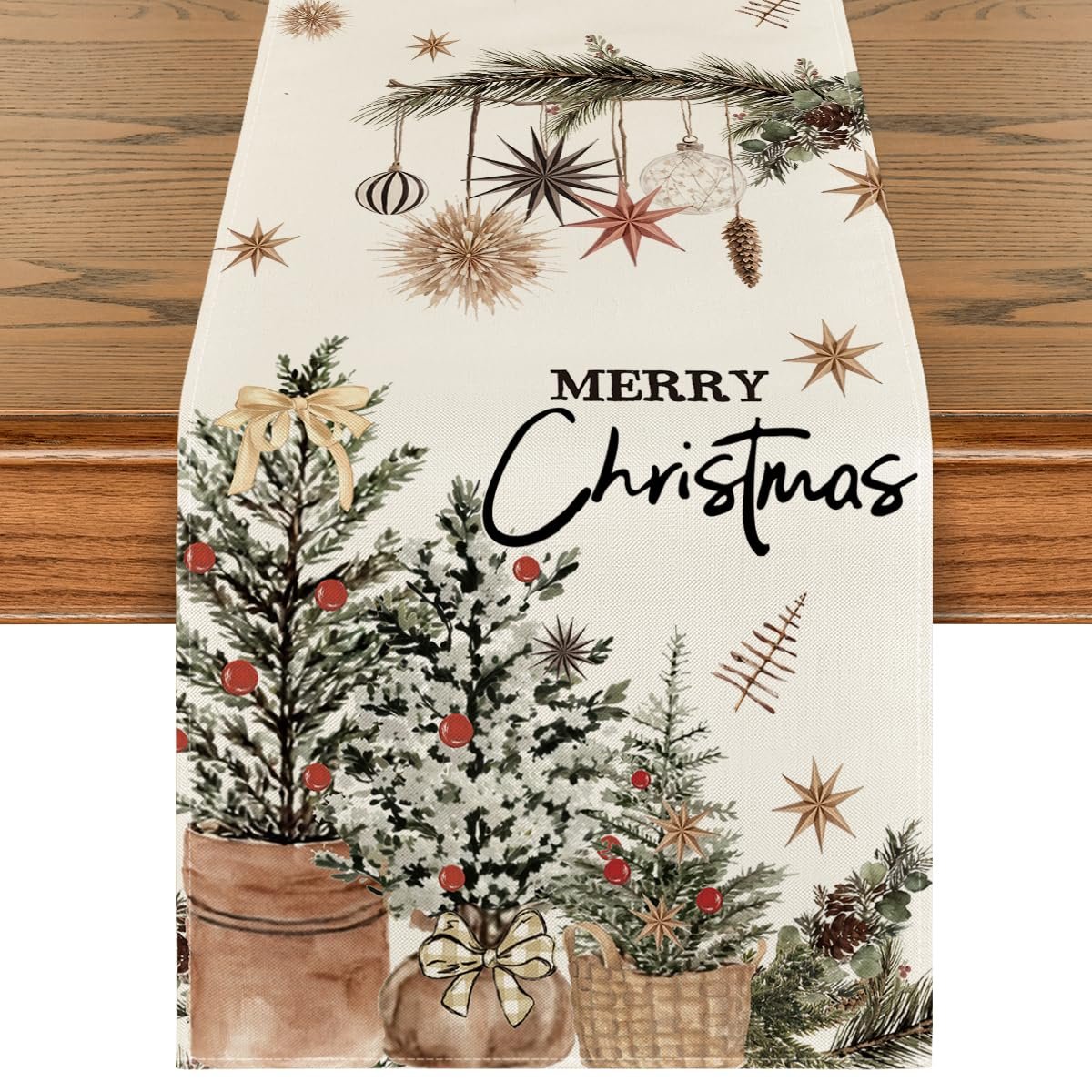 Christmas table runner with pine trees, ornaments, and 'Merry Christmas' text on a wooden table.