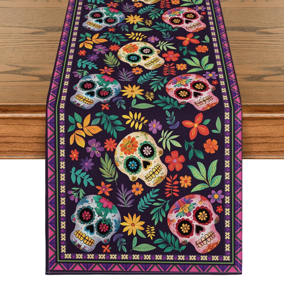 Sugar skull and floral patterned table runner on a wooden table