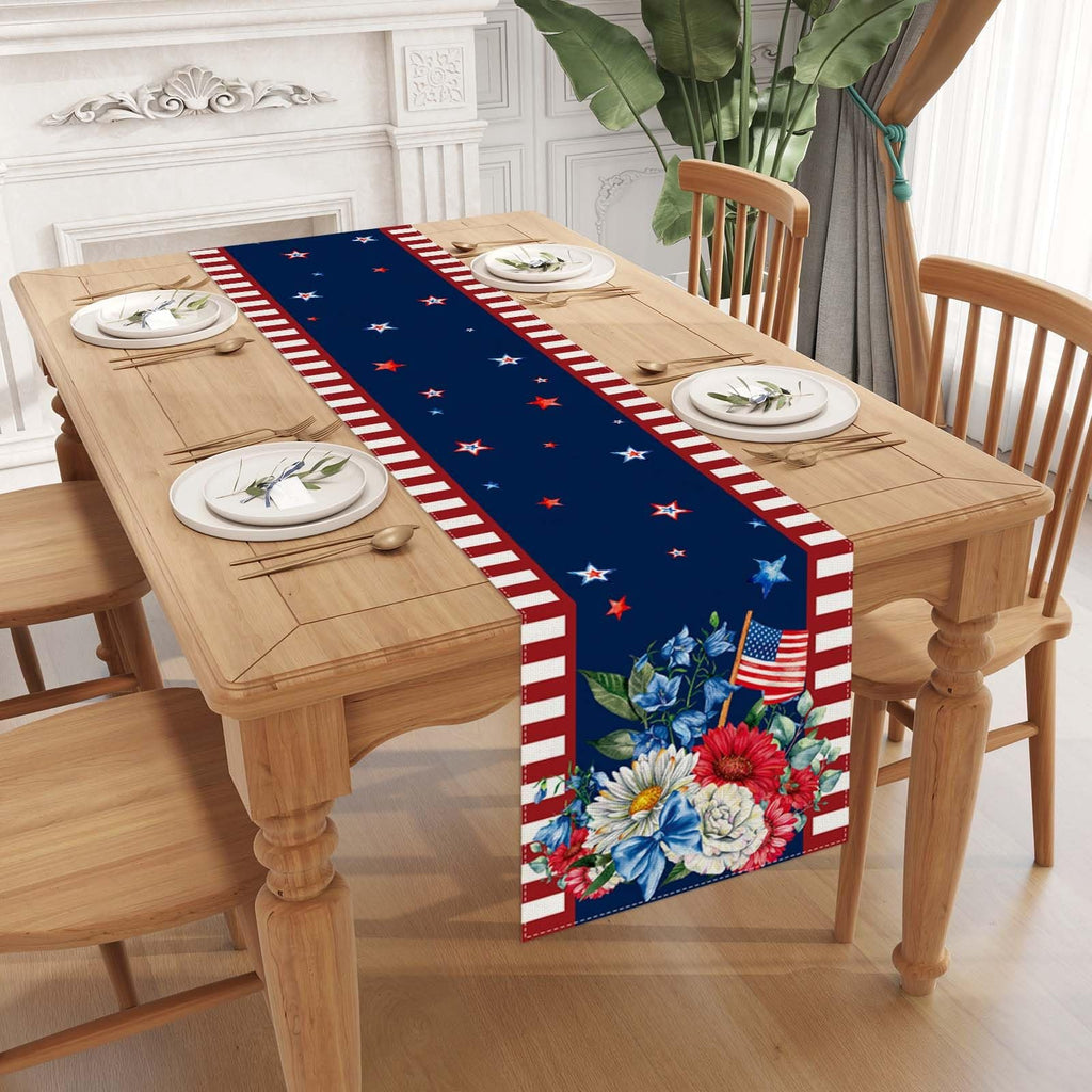 American flag and floral print table runner on a wooden dining table set for a meal.
