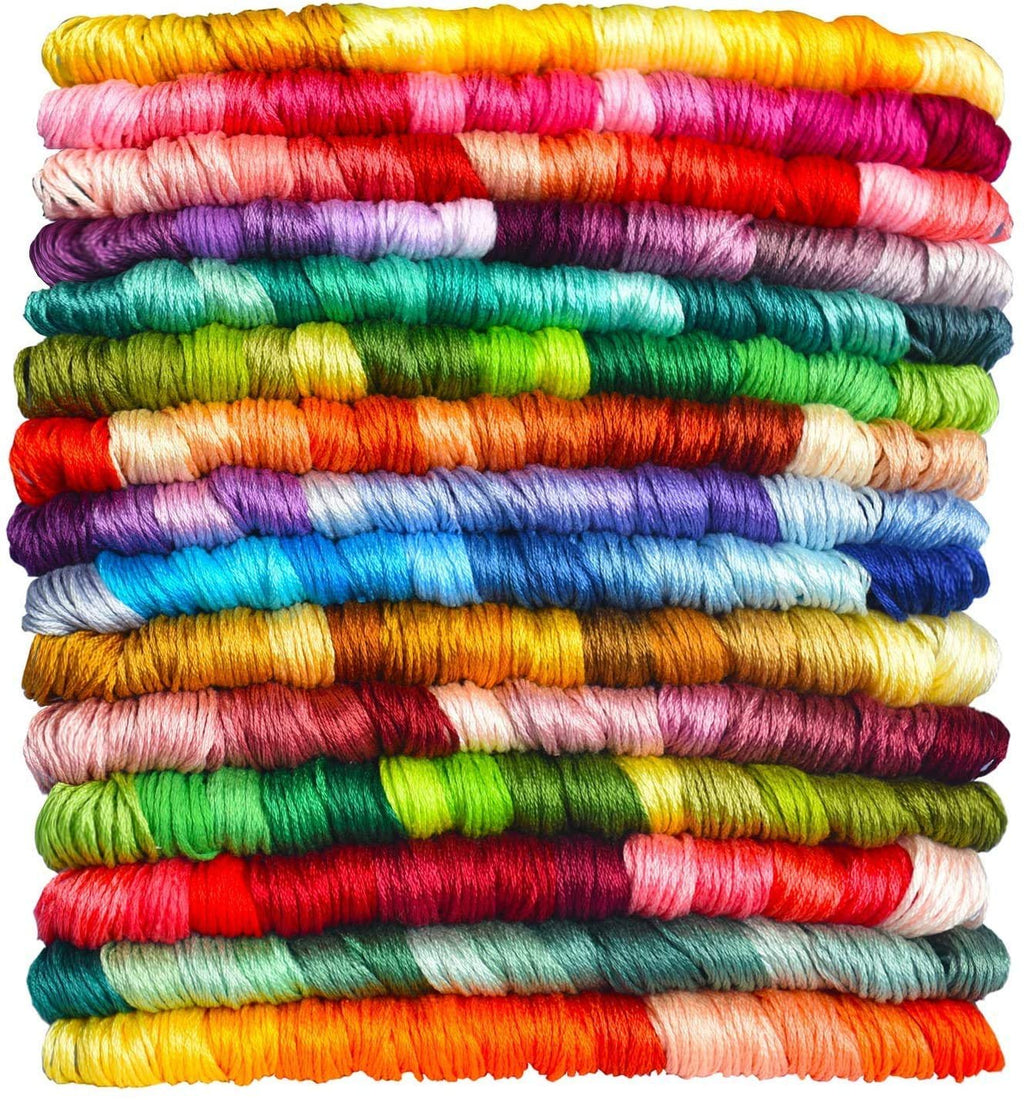 Stack of 14 skeins of gradient embroidery floss in various colors, close-up view.
