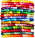 Stack of 14 skeins of gradient embroidery floss in various colors, close-up view.