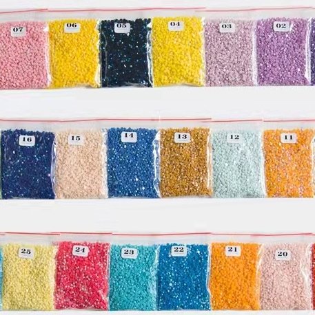 Bags of colored diamond painting beads numbered 02 through 25, arranged in rows.