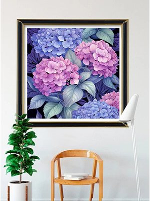 Diamond painting kit featuring a close-up of pink and purple hydrangeas with blue hydrangeas in the background, framed and hanging on a wall.