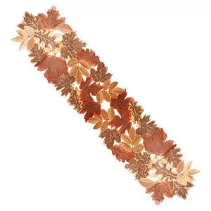 Fall leaves embroidered fabric table runner on white background, angled view.
