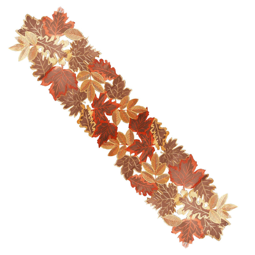 Embroidered fabric table runner with fall leaves in brown, orange, and gold.