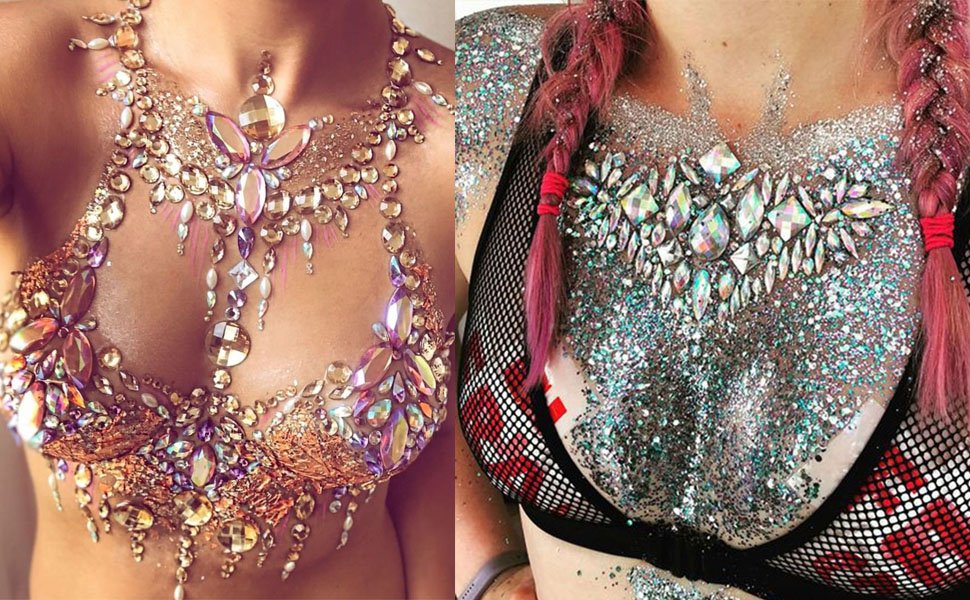 Two women wearing elaborate rhinestone and glitter body art for festivals or costumes.