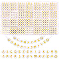Round letter beads in plastic organizer tray, with alphabet beads, heart beads, and smiley face beads.