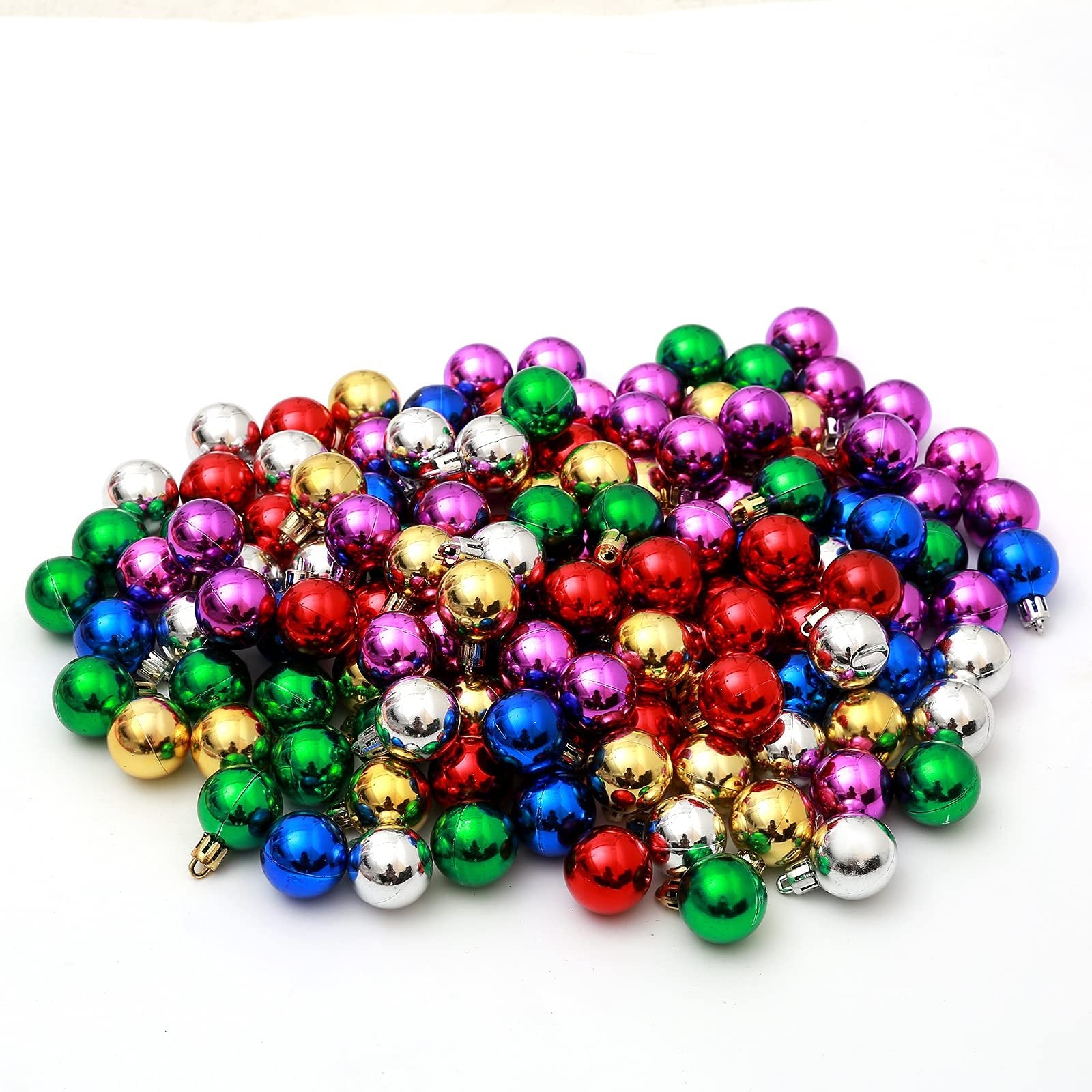Pile of small, colorful Christmas ball ornaments in red, green, gold, blue, purple, and silver.