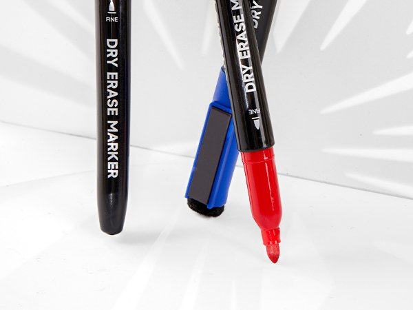 Close-up of three fine point dry erase markers with magnetic caps and built-in erasers on a white surface.