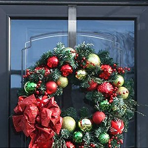 15-inch clear wreath hanger holding a festive holiday wreath on a dark door