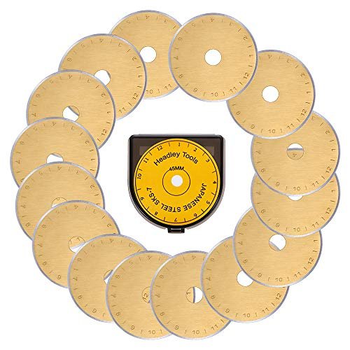 Fifteen 45mm rotary cutter blades arranged around a storage case, with markings and brand name visible on the case.
