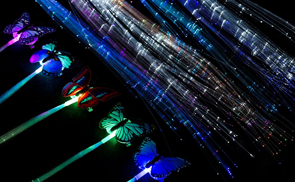 LED fiber optic hair clips with butterfly designs and glowing strands, displayed against a dark background.
