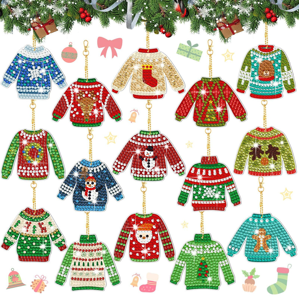 Collection of 15 diamond painting keychain kits shaped like ugly Christmas sweaters, displayed against a festive evergreen garland background.